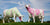 Two cows sculptures, painted in pastel colors as decorative objects of a landscape in a wedding