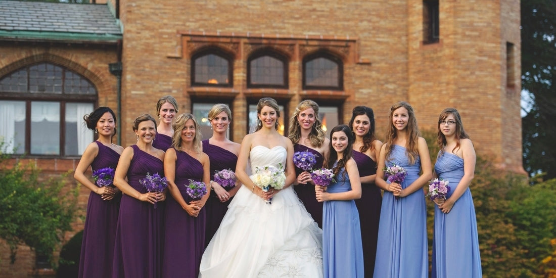 a beautiful photo of the bride and bridesmaids with their flower arrangements