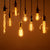 Several vintage light bulbs hanging together creating a nice and warm atmosphere.