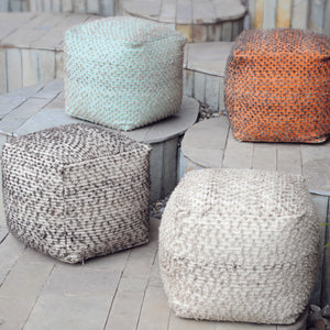Four Handwoven Poufs with a neutral beige cotton, grey, orange and aqua marine.