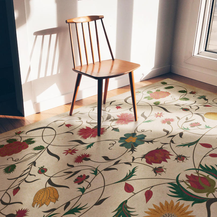 A vintage binyl floor mat with a flowers pattern, in a room with a window and the sun light coming through, a wood chair is on the foormat