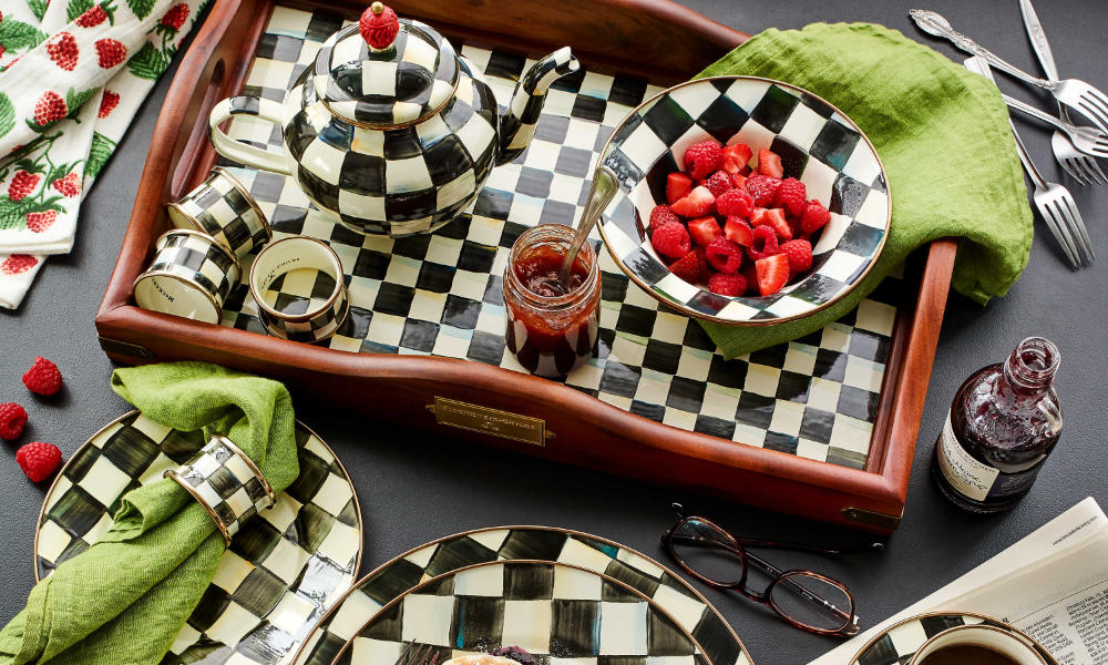 A Mackenzie Childs tray, a small serving bowl and a tea kettle, all in a courtly check pattern