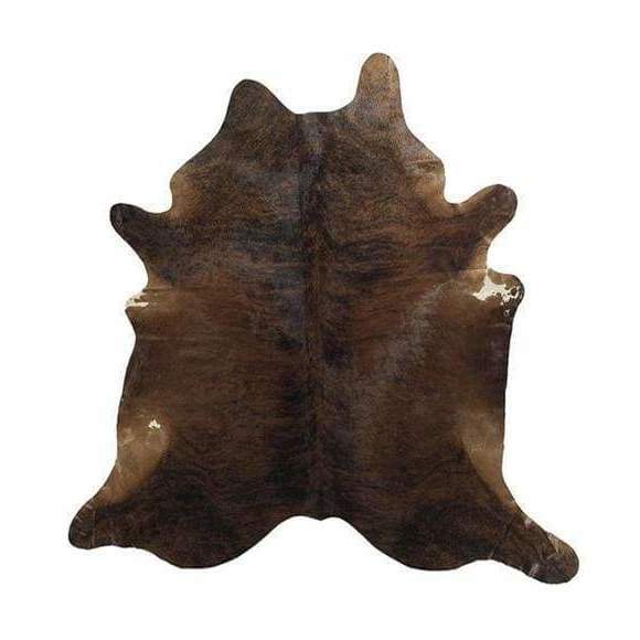 A Cowhide Rug in a Dark Brindle pattern, with brown and whites shapes