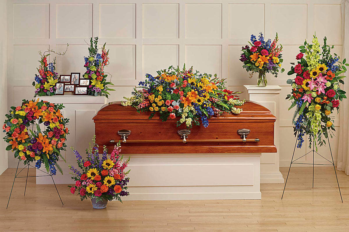 A collection of funeral flower arrangements.featuring six hand-made pieces that are both radiant and reverent.&amp;nbsp;Includes the following six sympathy set pieces: Colorful Reflections Casket Spray, Love Lives On Spray, Colorful Serenity Wreath, Hues Of Hope Bouquet DX, Loving Farewell Photo Tribute Bouquet DX, Colors Of The Rainbow Bouquet DX