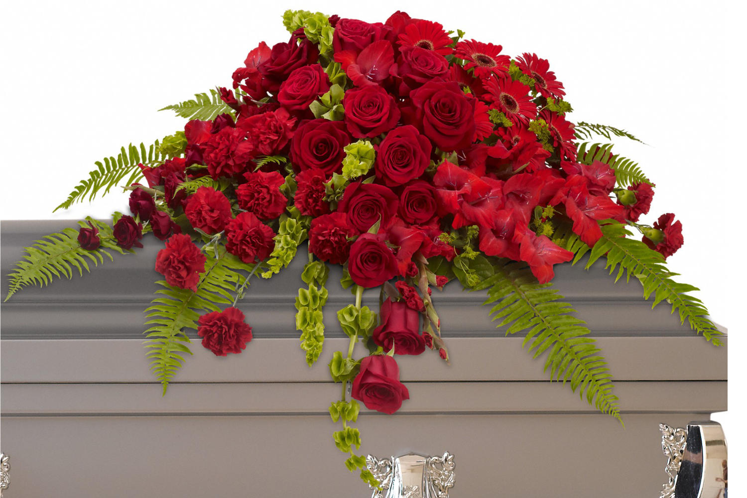 Funeral Flowers arrangement. Beautiful red roses, spray roses, gerberas, gladioli and carnations along with vibrant green bells of Ireland create a sincere tribute.