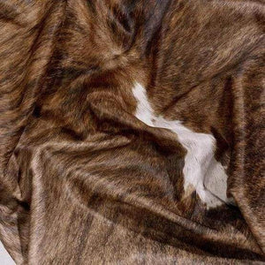 A Cowhide Rug in a Tricolor pattern