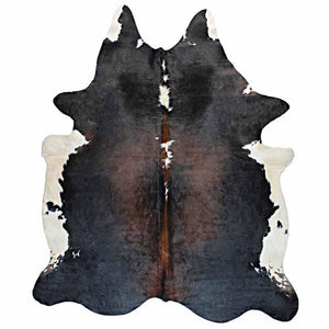 A Cowhide Rug in Black, Brown, and White - One of a Kind