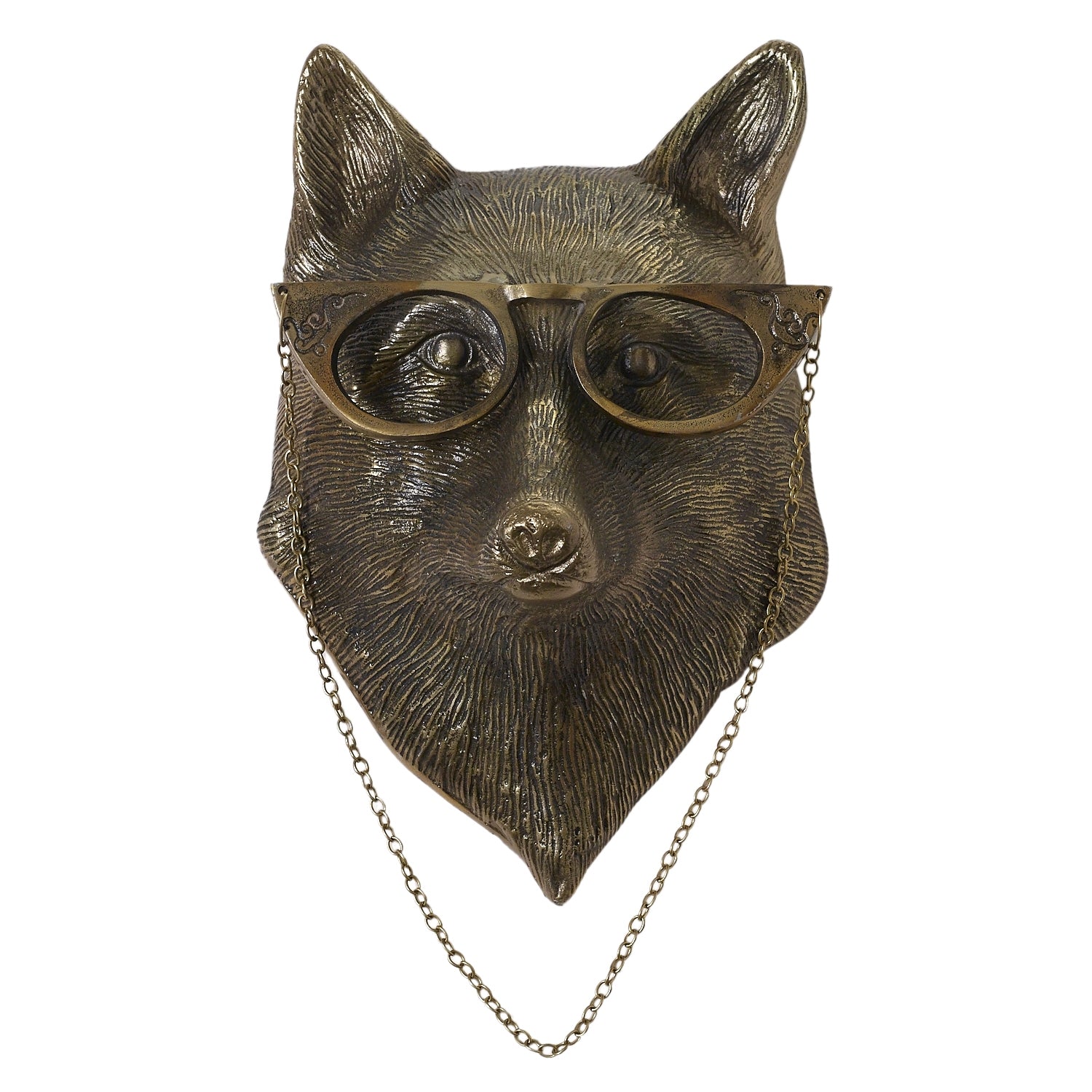 metal fox head in a brass finish wearing glasses. Her glass have a chain she can keep them around her neck