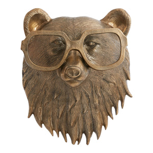 a head of a bear in metal with brass finish. the bear is using big readers
