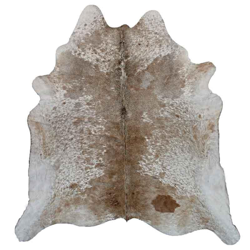 A Cowhide Rug in a Tan & White Natural Color